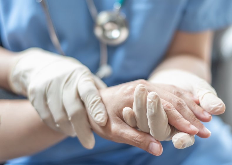 hand health care worker patient, getty