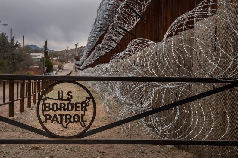 US Border Patrol Sign on Fence