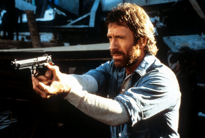 Chuck Norris points a gun