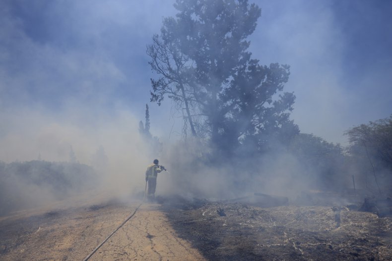 Israeli Firefighter Extinguish Flames From Protest