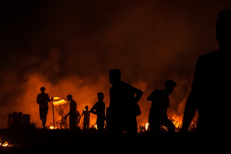 Palestinian protesters pictured at Gaza border Israel