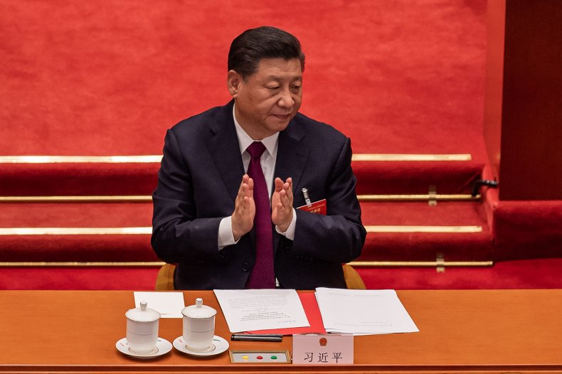 China's President Xi Jinping applauds