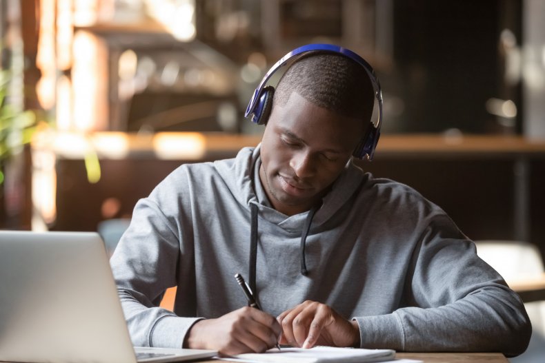 Student studying with headphones
