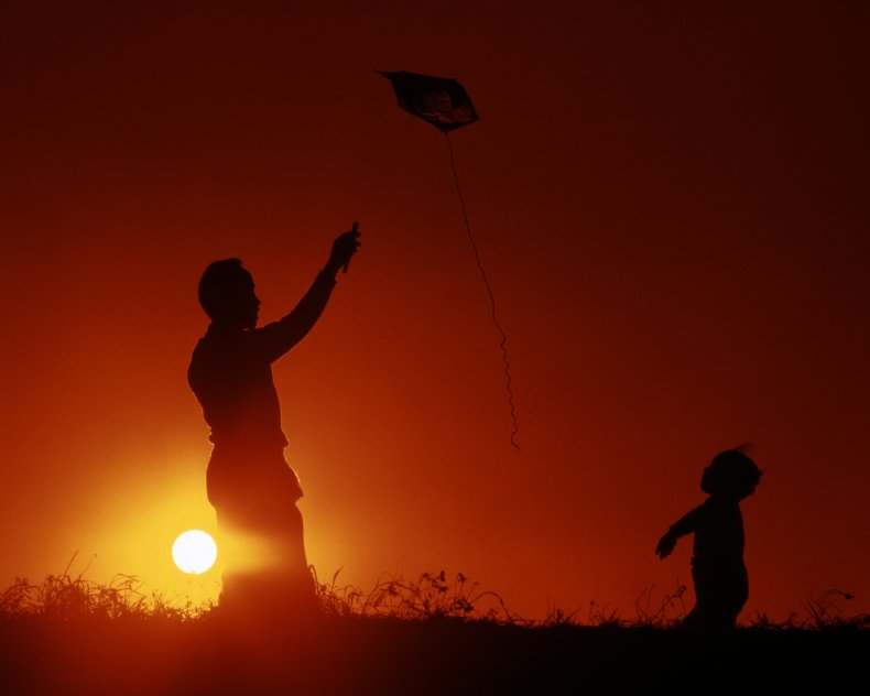 Silhouette of a father and son