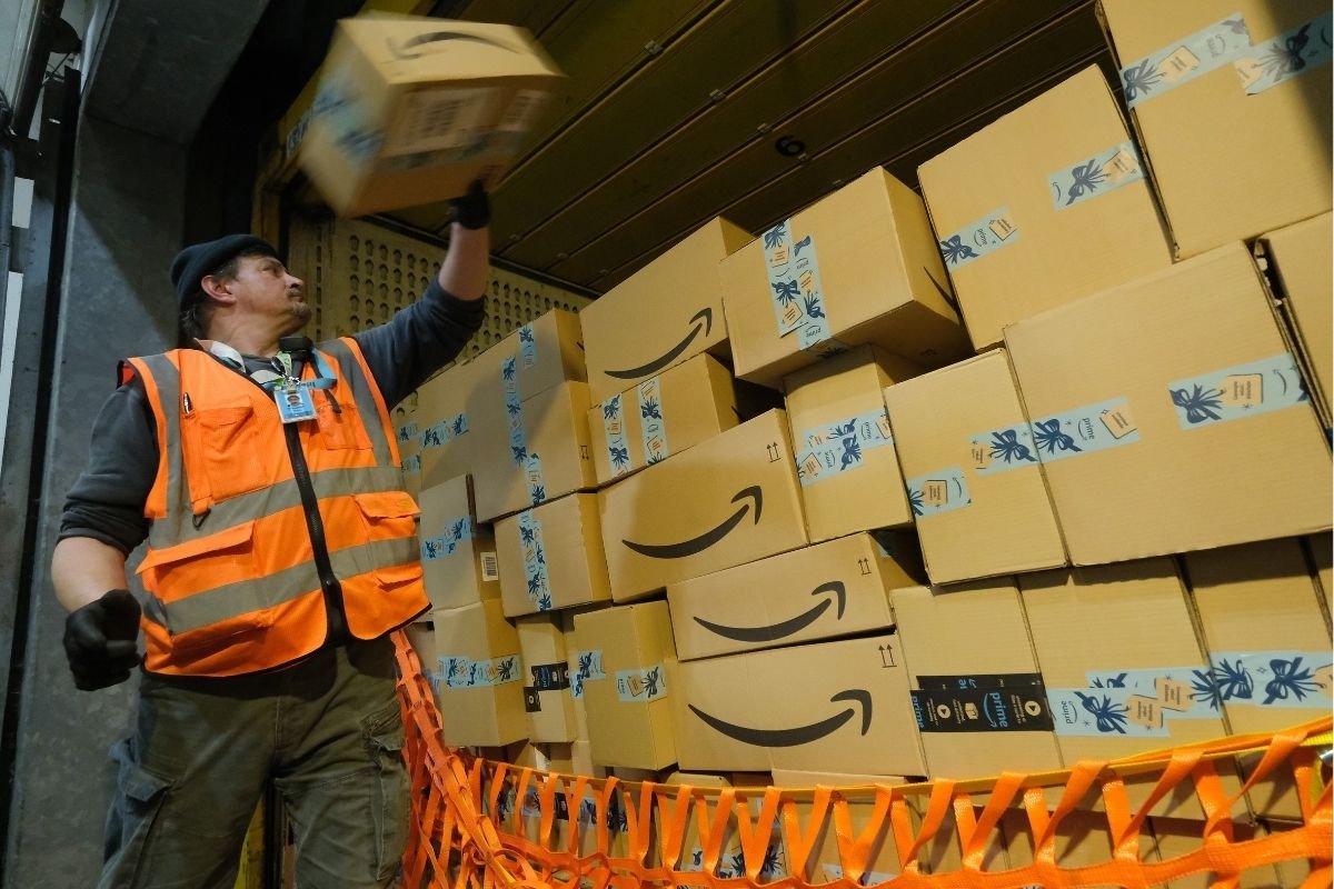 Worker loading Amazon van in Germany