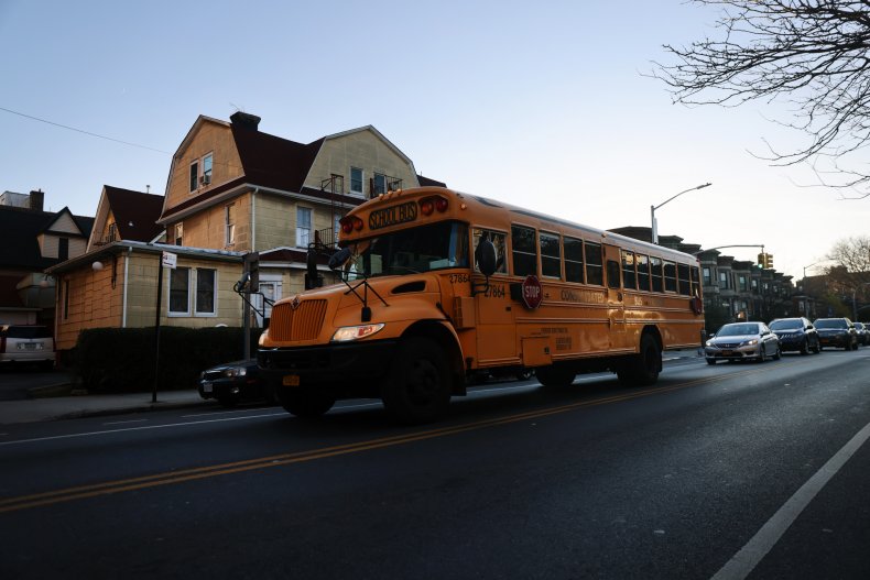 A school bus drives through Brooklyn.