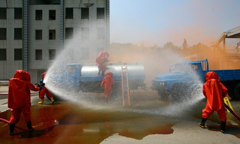 Chinese Firemen In Chemical Hazard Drill