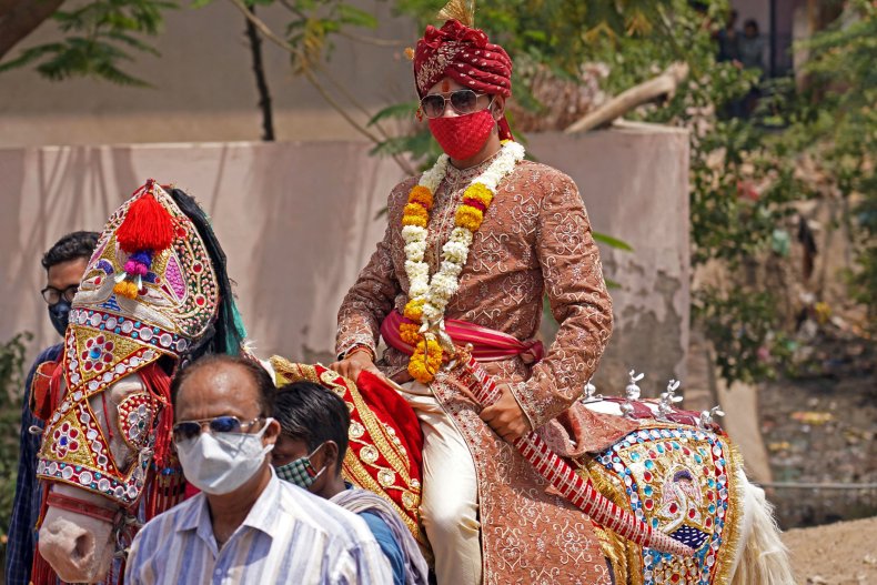 An Traditionally-Dressed Indian Groom Rides a Horse