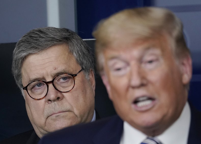 William Barr looks over Donald Trump's shoulder