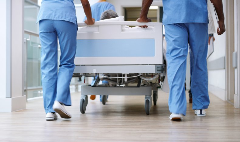 Nurses pushing bed