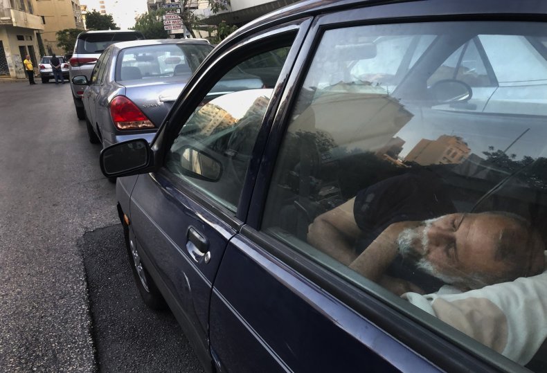 Taxi Driver Sleeps While Waiting for Gasoline