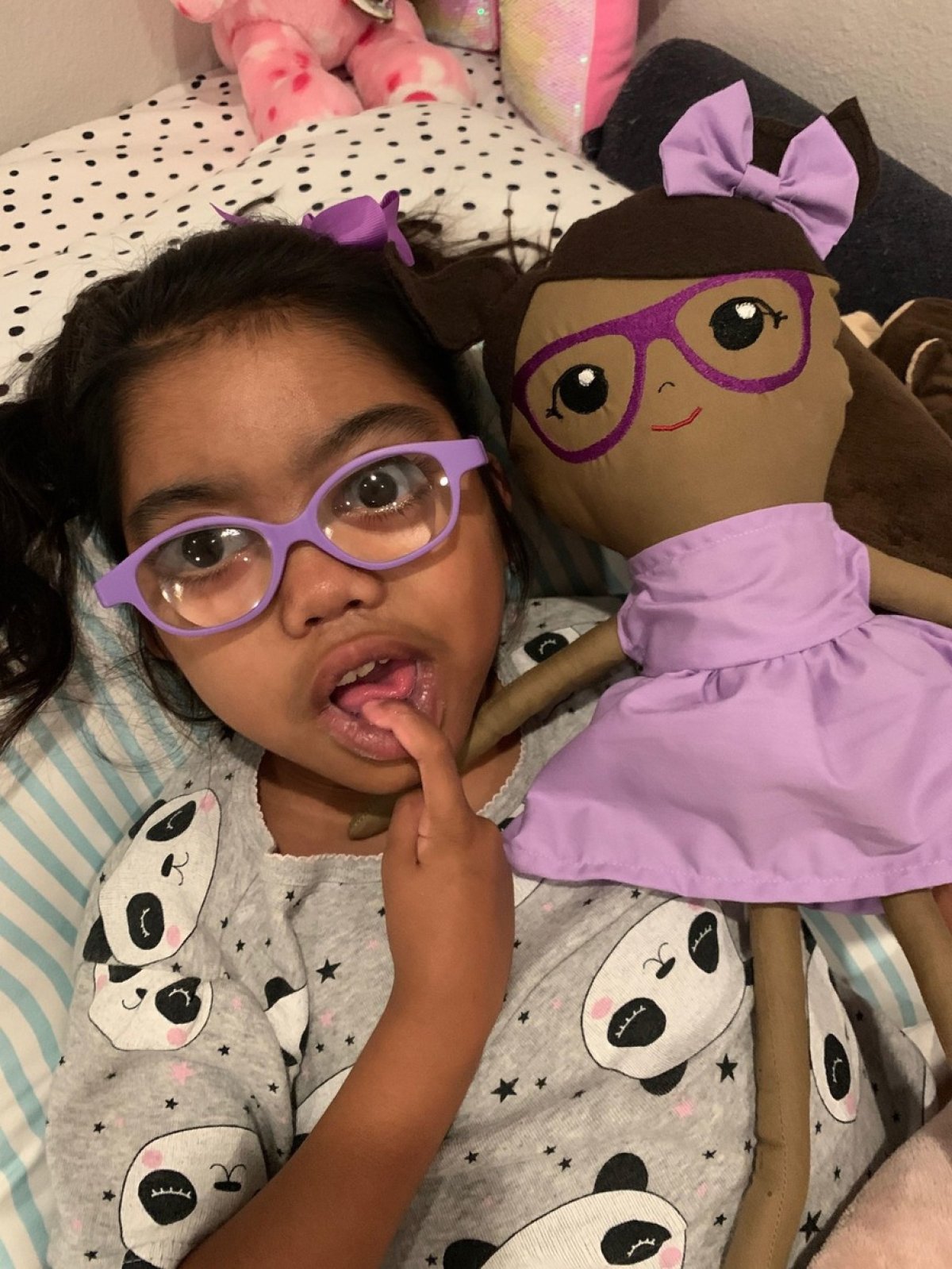 Reagan Martinez hangs out with doll Rea-Rea.
