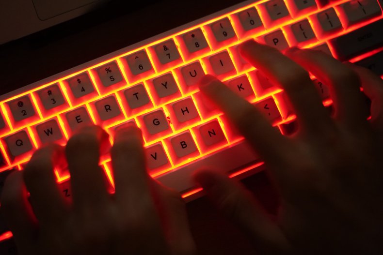 Man using illuminated keyboard