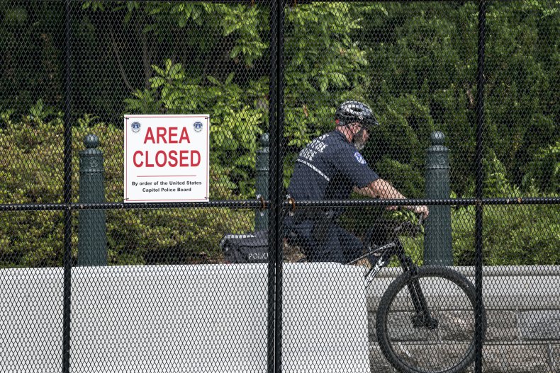 U.S. Capitol Police Officer Patrols Fence