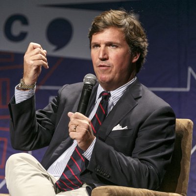 Tucker Carlson speaks onstage during Politicon
