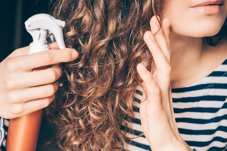 A woman caring for curly hair
