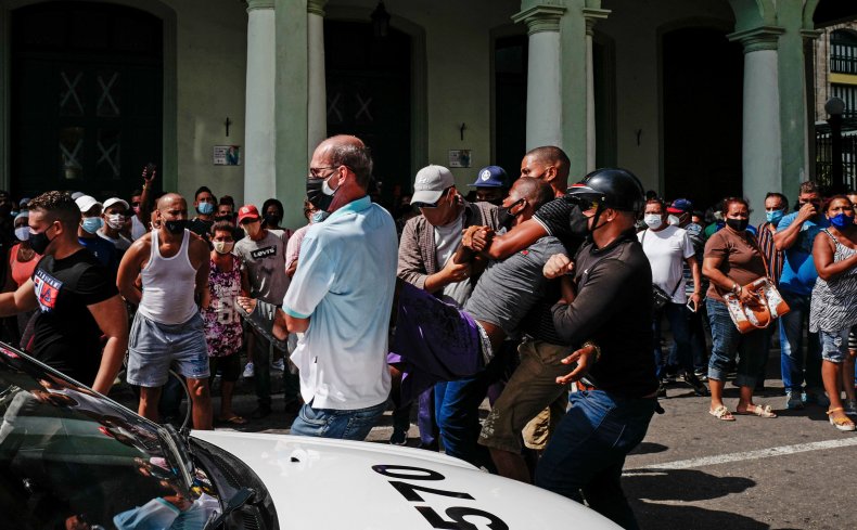 What Is Happening in Cuba? Protests and Unrest
Explained 2 A man is arrested during a demonstration