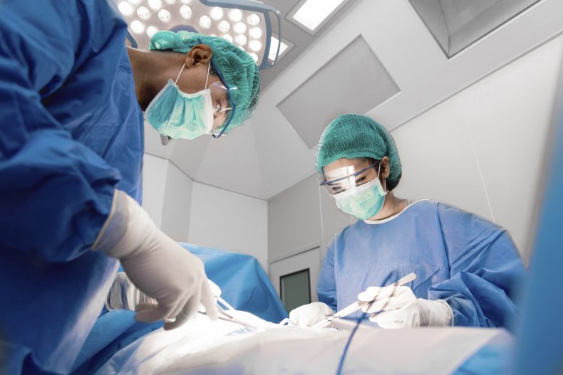 Surgeons operate on a patient