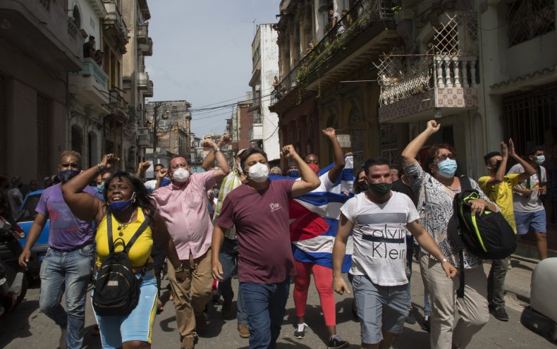 Cuba's President Says 'Cuban-American Mafia' Ignited
Protests Through Social Media 2 Government Supporters Against Cuban Protesters