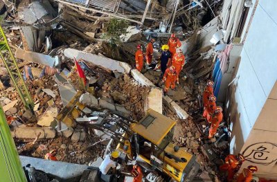 Rescuers Search Rubble After Fatal Hotel Collapse