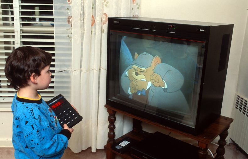 Little boy watches TV in 90s