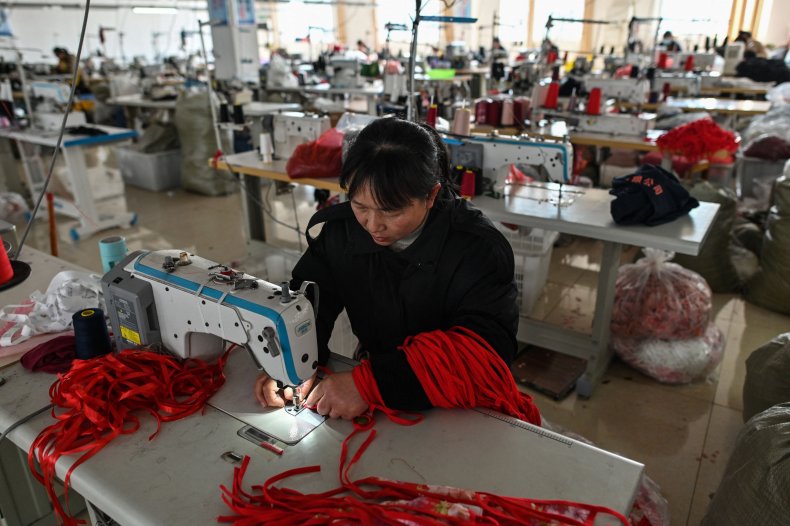 A worker sewing 