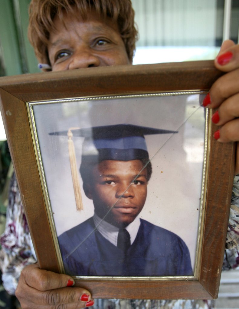 The author's mother holding a photo
