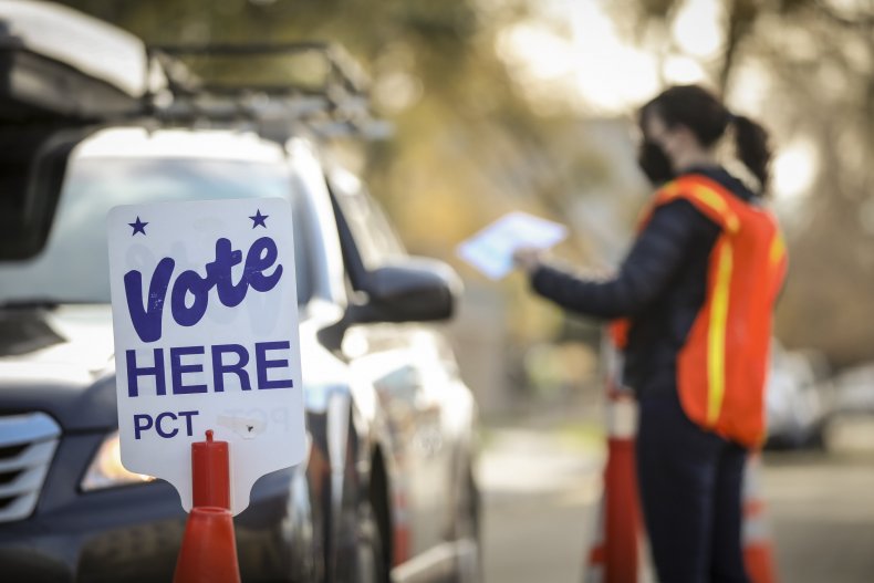 Person votes at drive-thru polling station