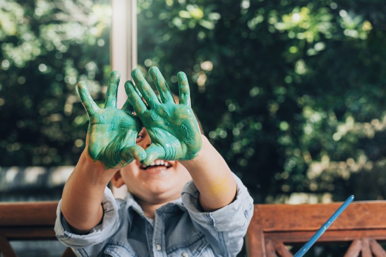 Child playing with paint 