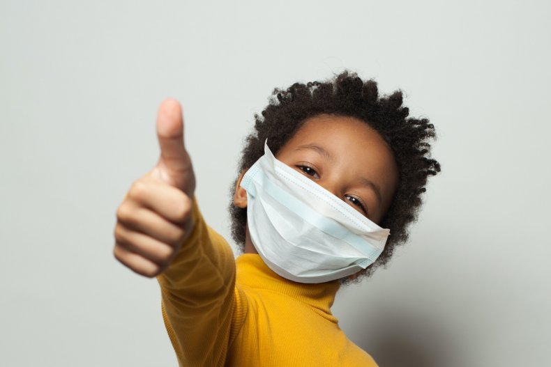 Child with thumbs up