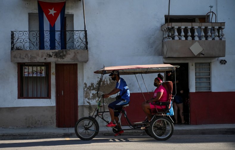 People ride on a bicitaxi
