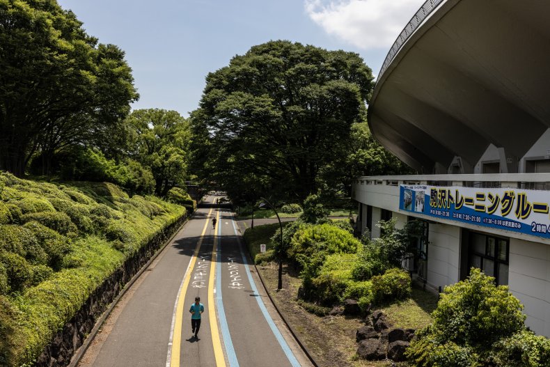 Joggers near Tokyo's Komazawa Olympic Park Stadium.