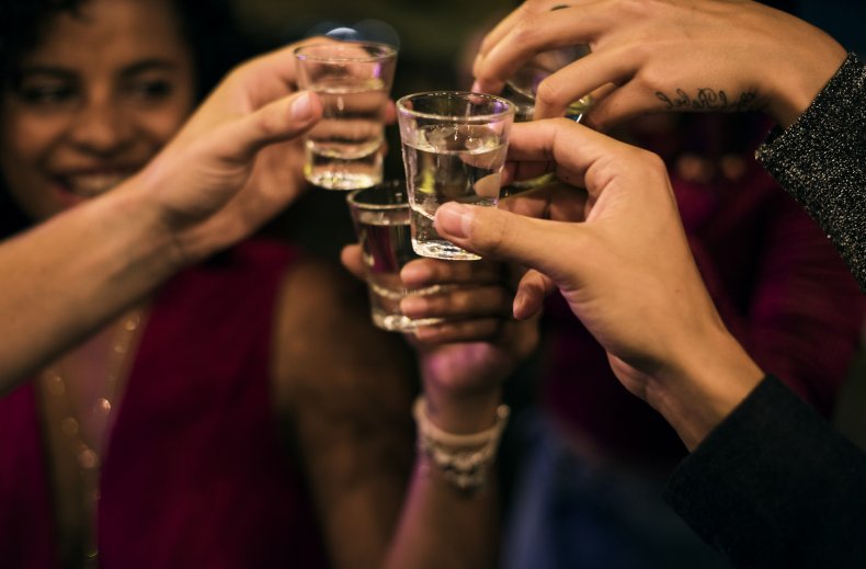 A group drinking shots at a bar