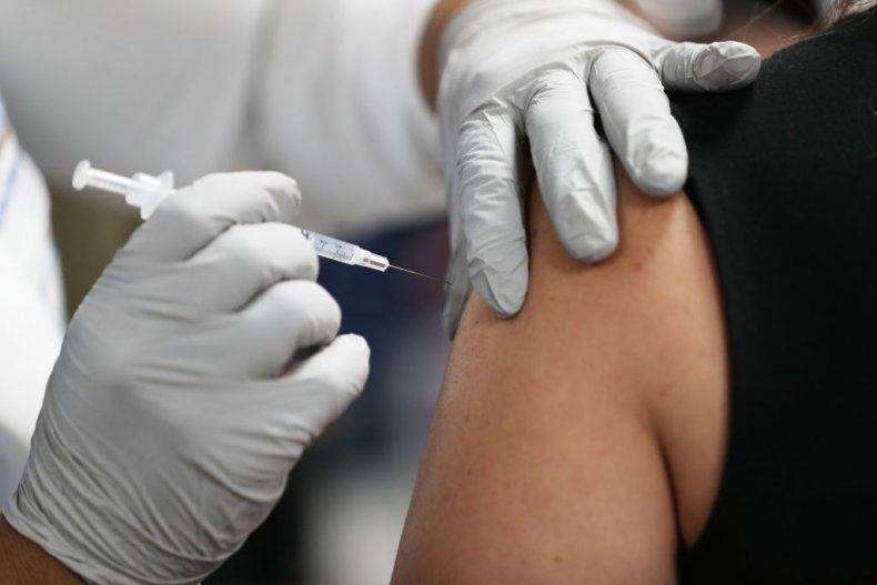 healthcare worker receives Pfizer-BioNtech vaccine