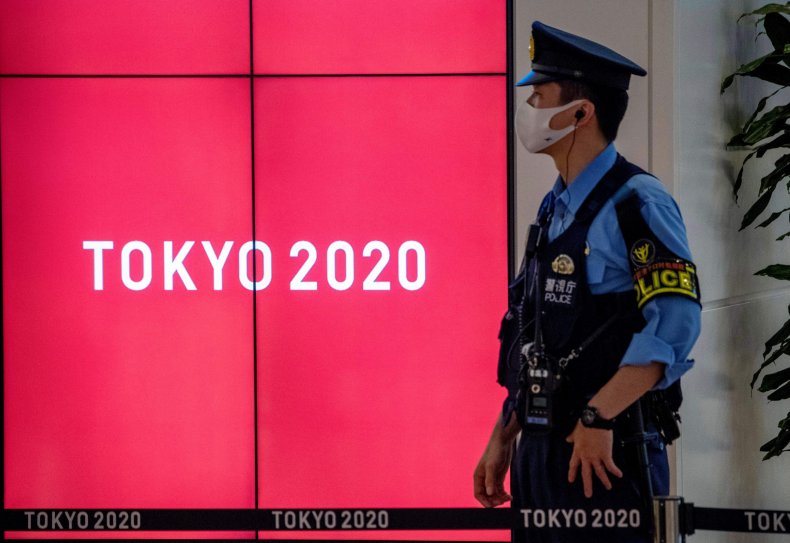 A policeman stands guard at the arrival