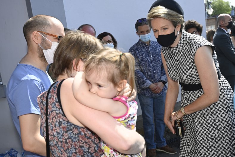 Queen Mathilde comforts victims