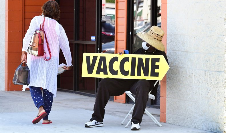 Man Holds Vaccine Sign