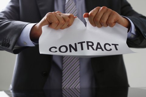 Man tearing up contract