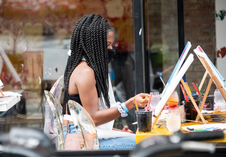 A person paints