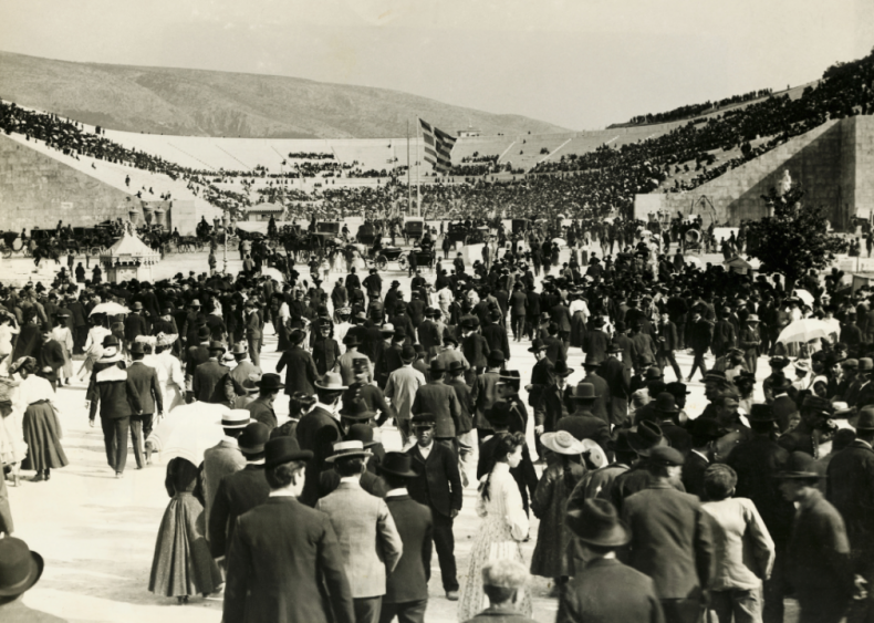 A crowd of 80,000 fills the Panathenaic Stadium