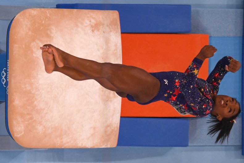 Simone Biles flies off the vault.