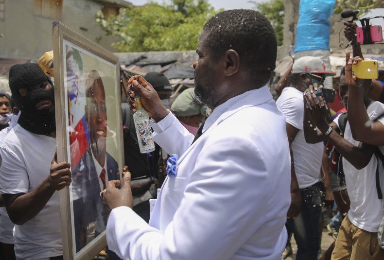 Cherizier blesses a photo of Moise