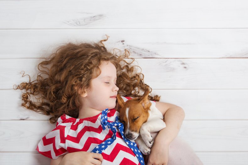 Little girl and dog sleeping