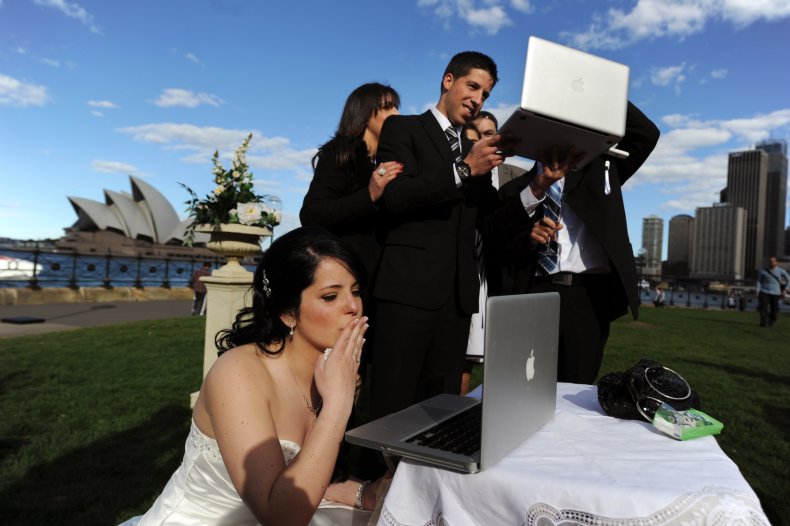 Groom stirs controversy working on laptop