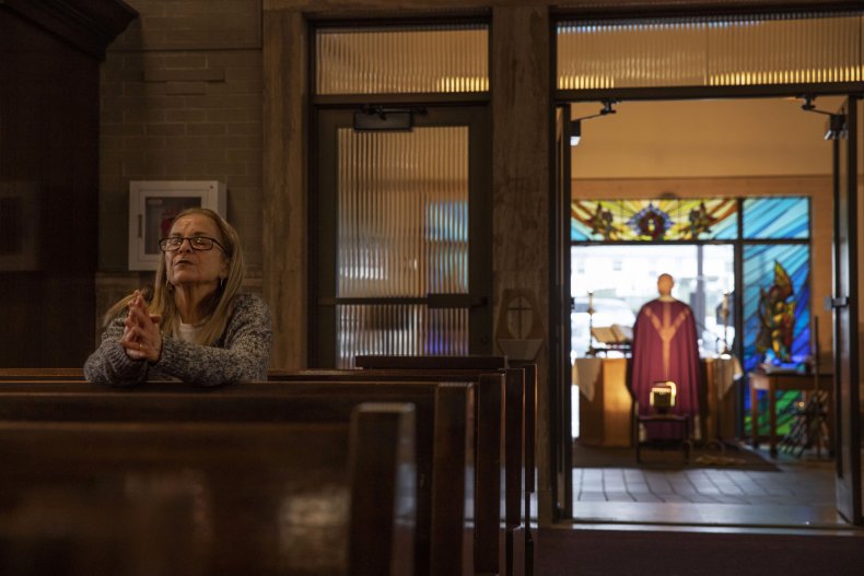 Woman prays alone in church