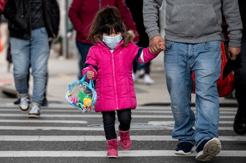 Biden defends updated COVID mask guidelines