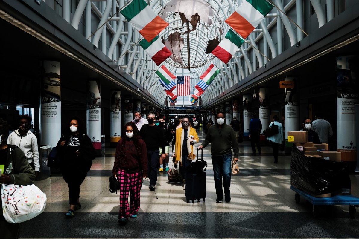 People walking through Chicago's O’Hare airport. 