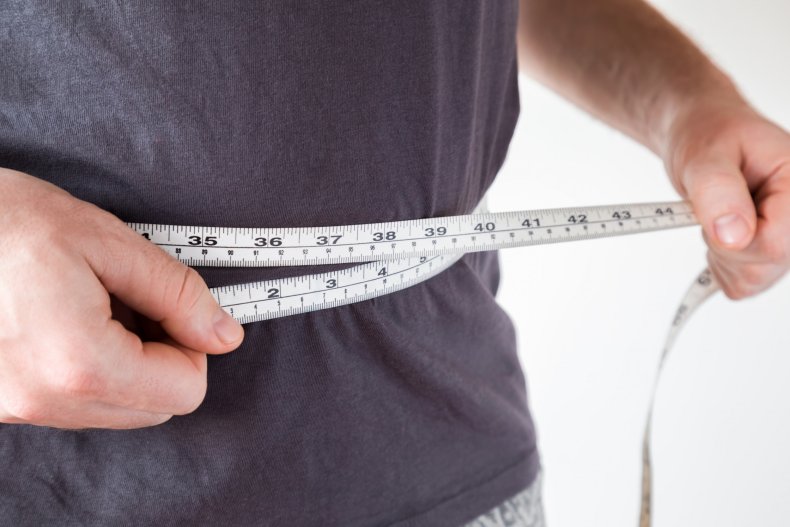 Man measuring his waist