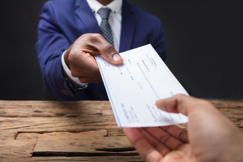File photo of a paycheck.