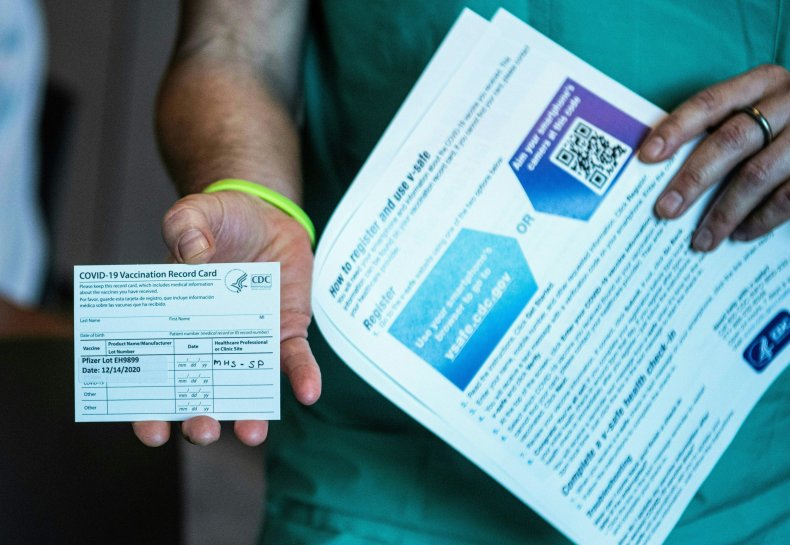 Man shows off vaccination card